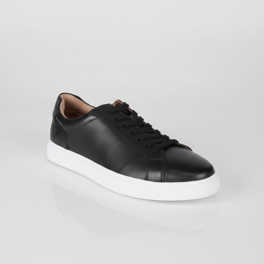 Black leather sneaker with white sole on a white background